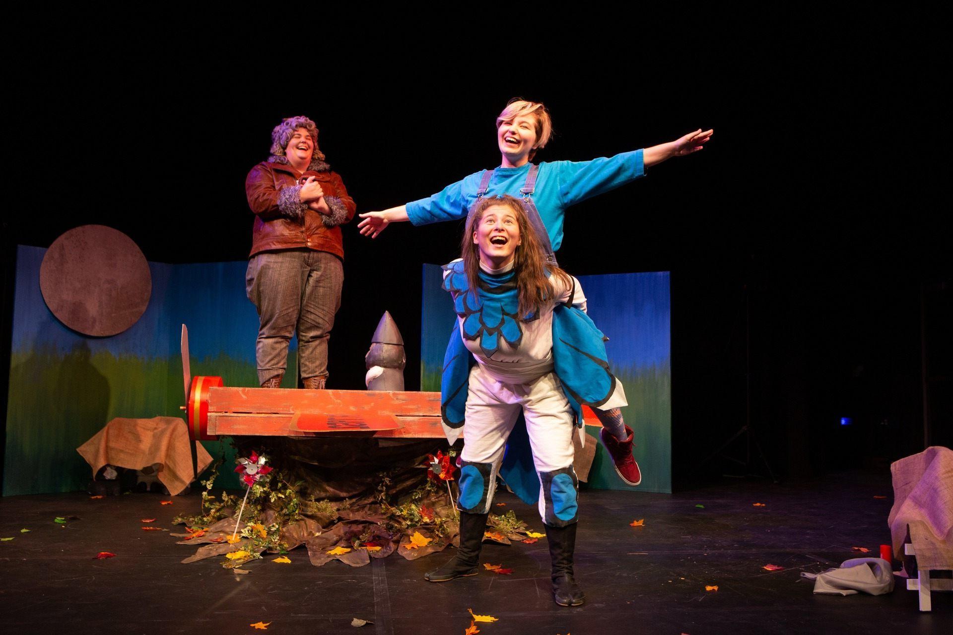 student actors performing in youth theatre production